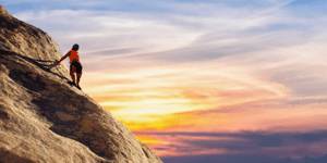 woman climbing mountain
